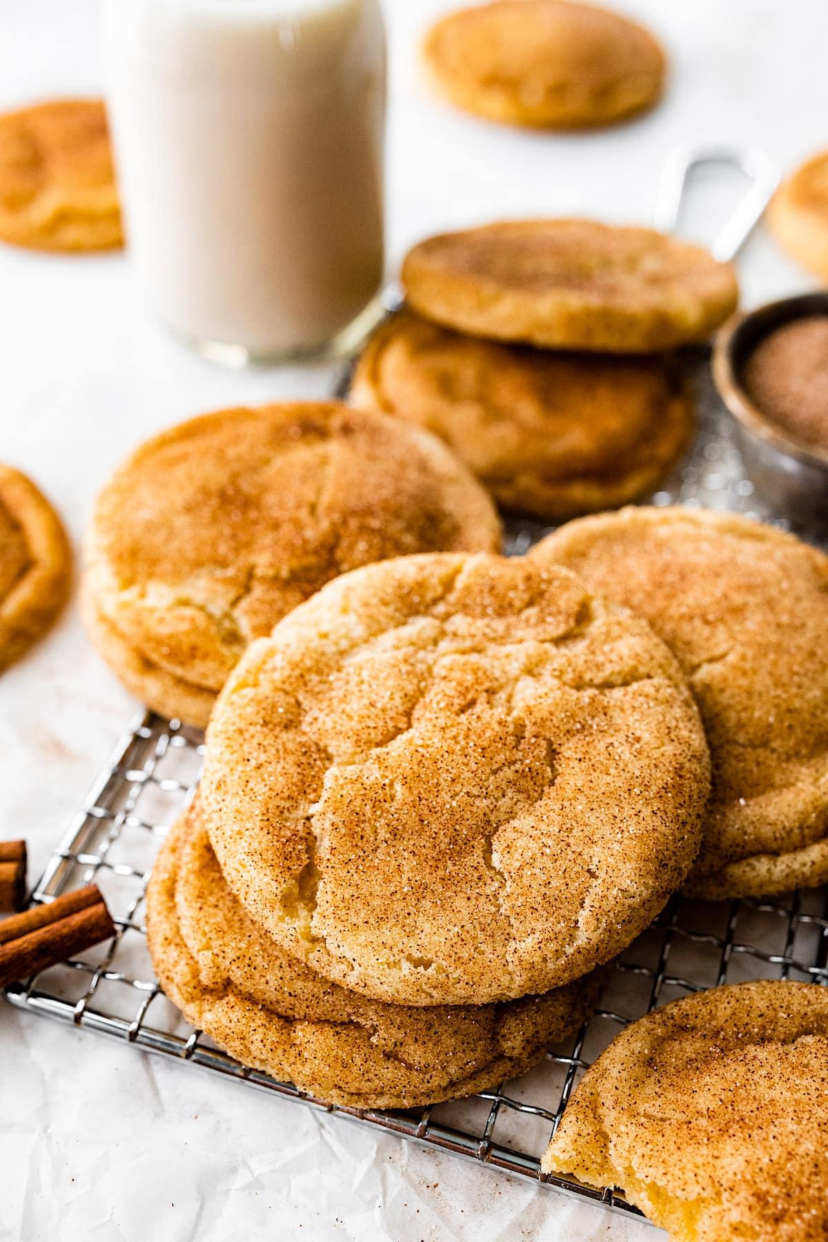 freshly baked snickerdoodle cookies on a cooling rack, cinnamon sugar sparkle