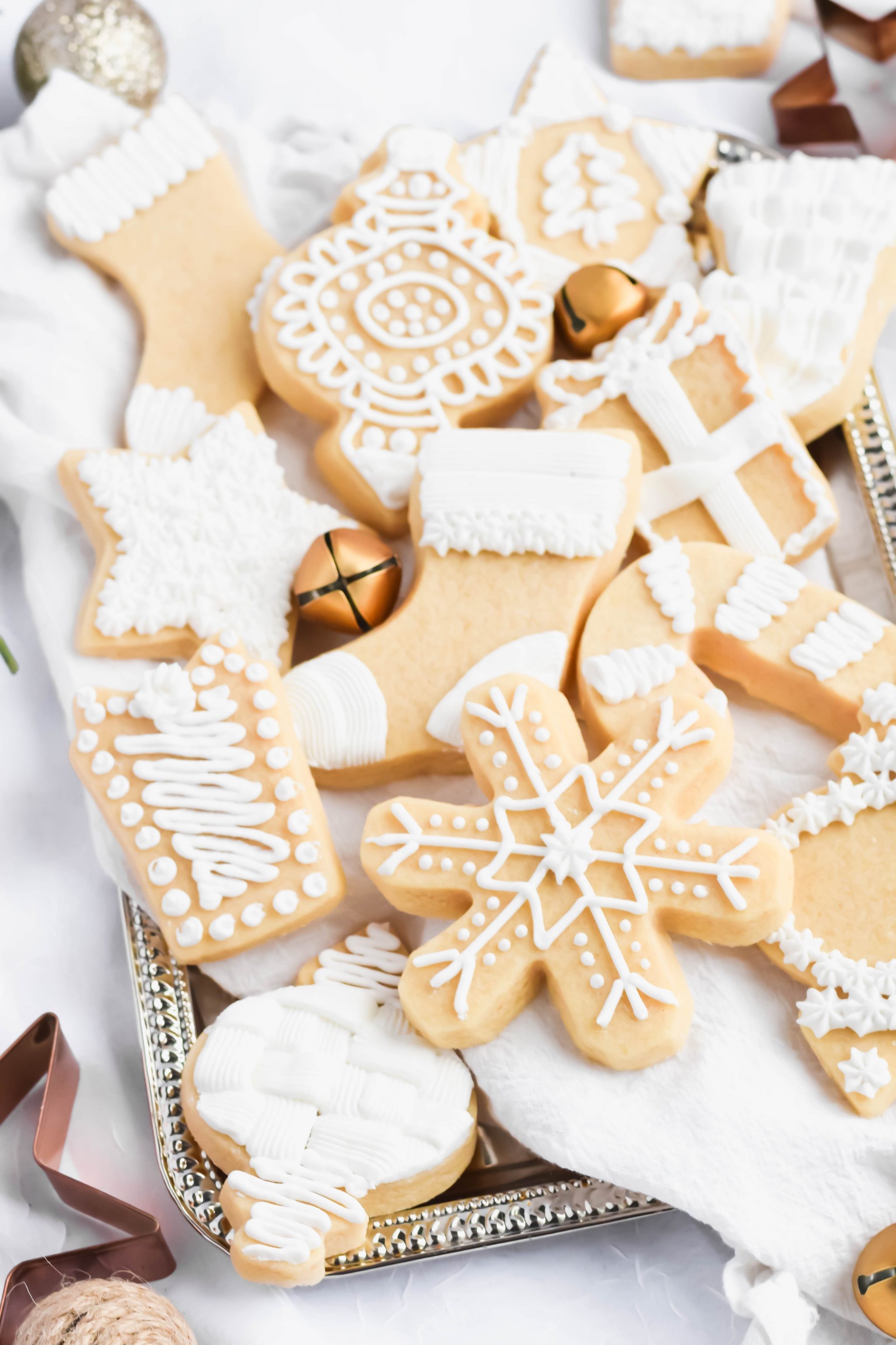 Beautifully decorated shortbread cookies with intricate royal icing designs, close-up, natural light