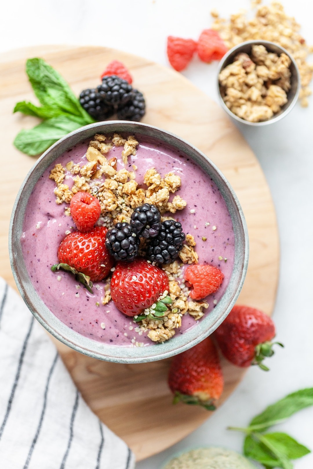 Acai berry smoothie bowl with fresh fruits and nuts