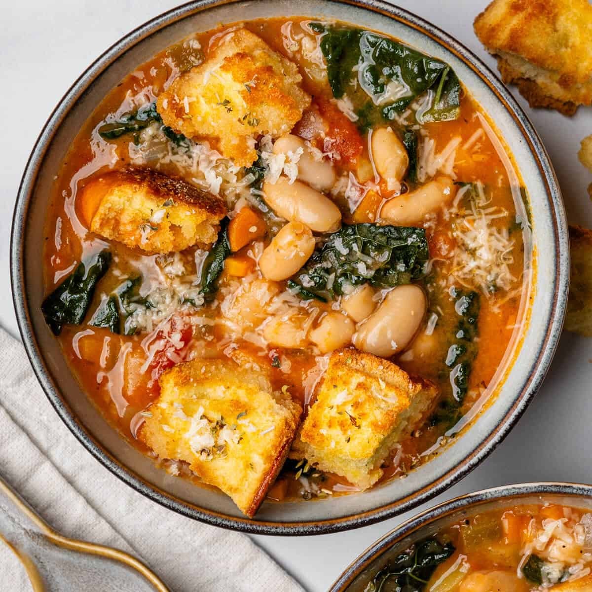 bowl of Tuscan white bean soup with crusty bread