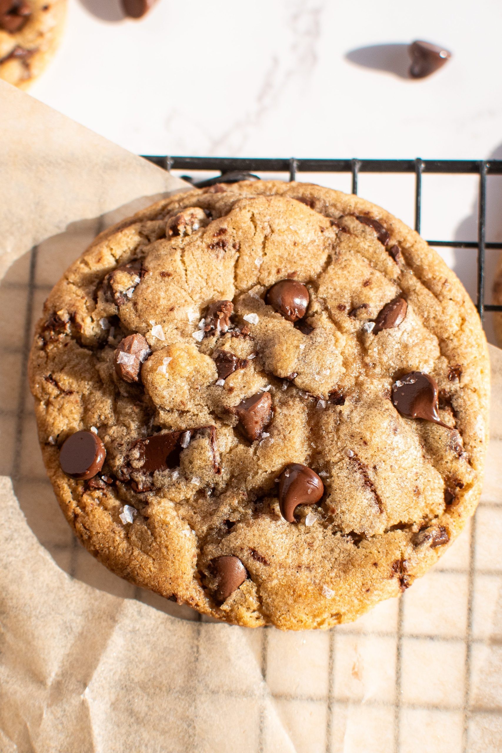 Perfectly baked chocolate chip cookies with a soft center, close-up, warm tones