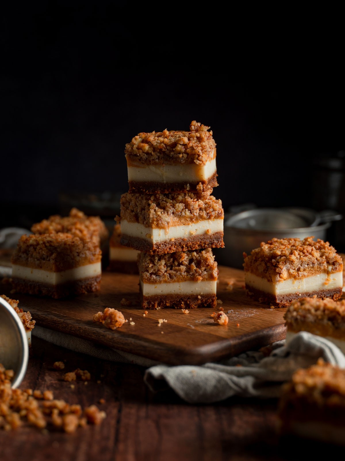 sugar-free pumpkin cheesecake bars on a wooden surface