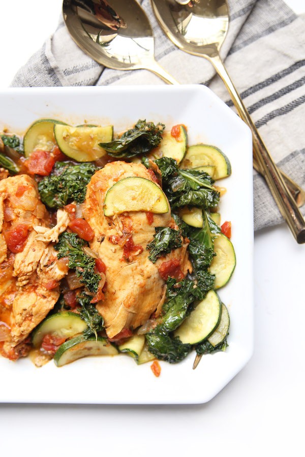 A vibrant and appetizing healthy crockpot dinner, showcasing colorful vegetables and lean protein, steam gently rising, on a rustic wooden table