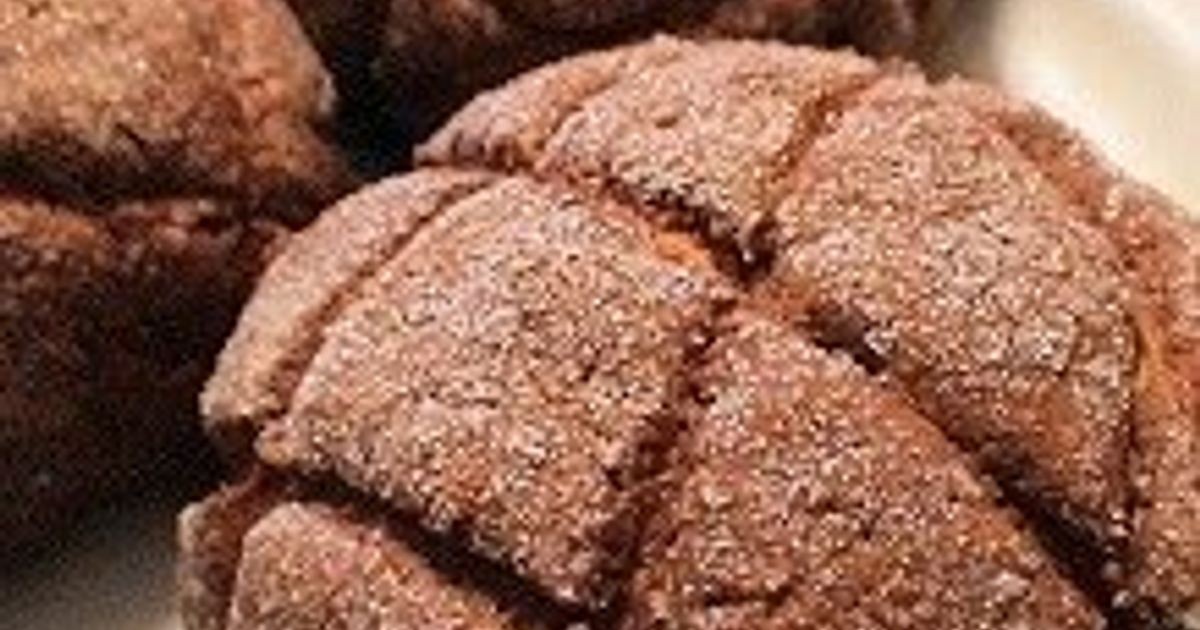 A luscious Melon Pan Sweet Bread Chocolate Layer Cake, showcasing its layers and chocolate drizzle