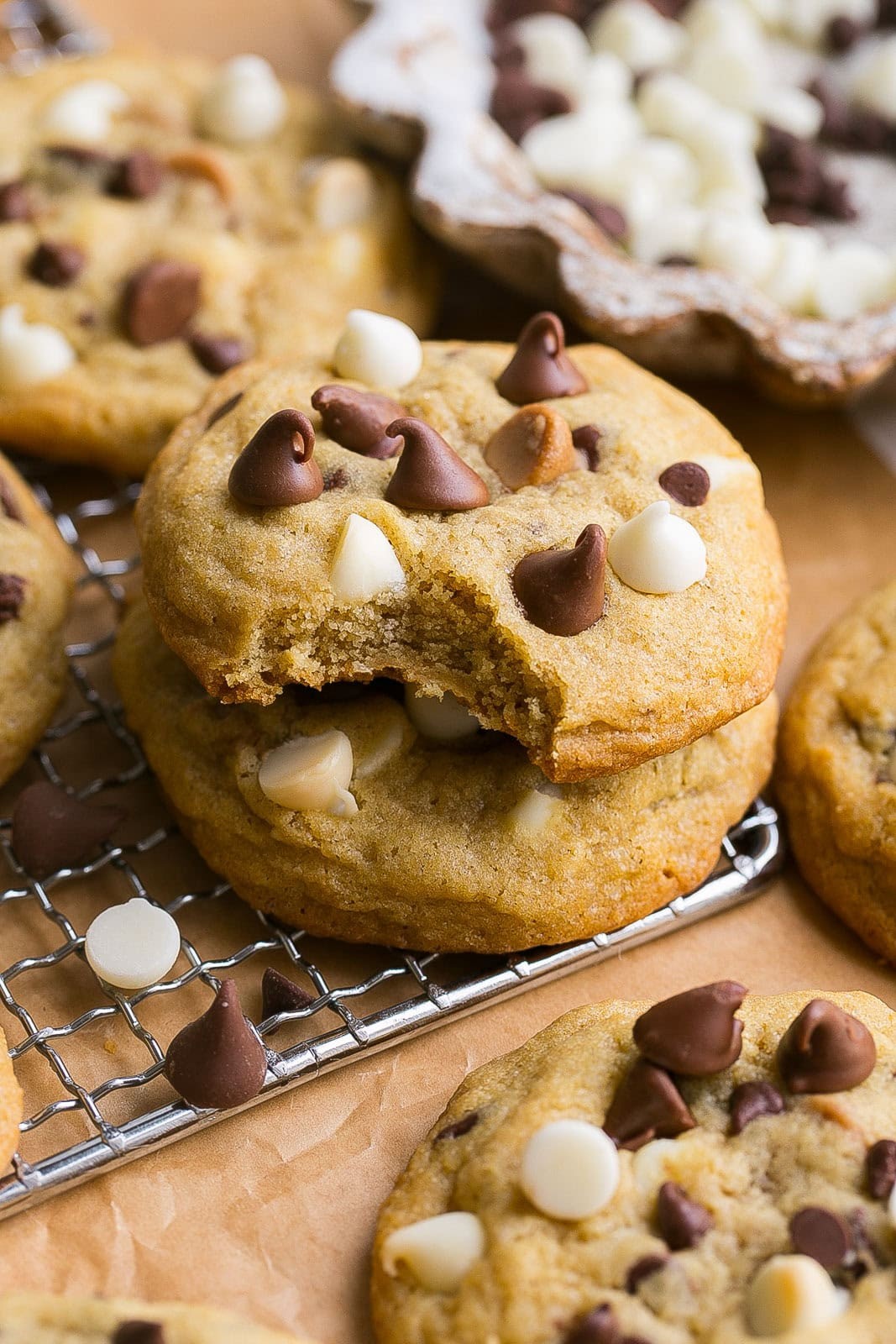 Warm triple chip cookie slabs on a cooling rack, gooey chocolate