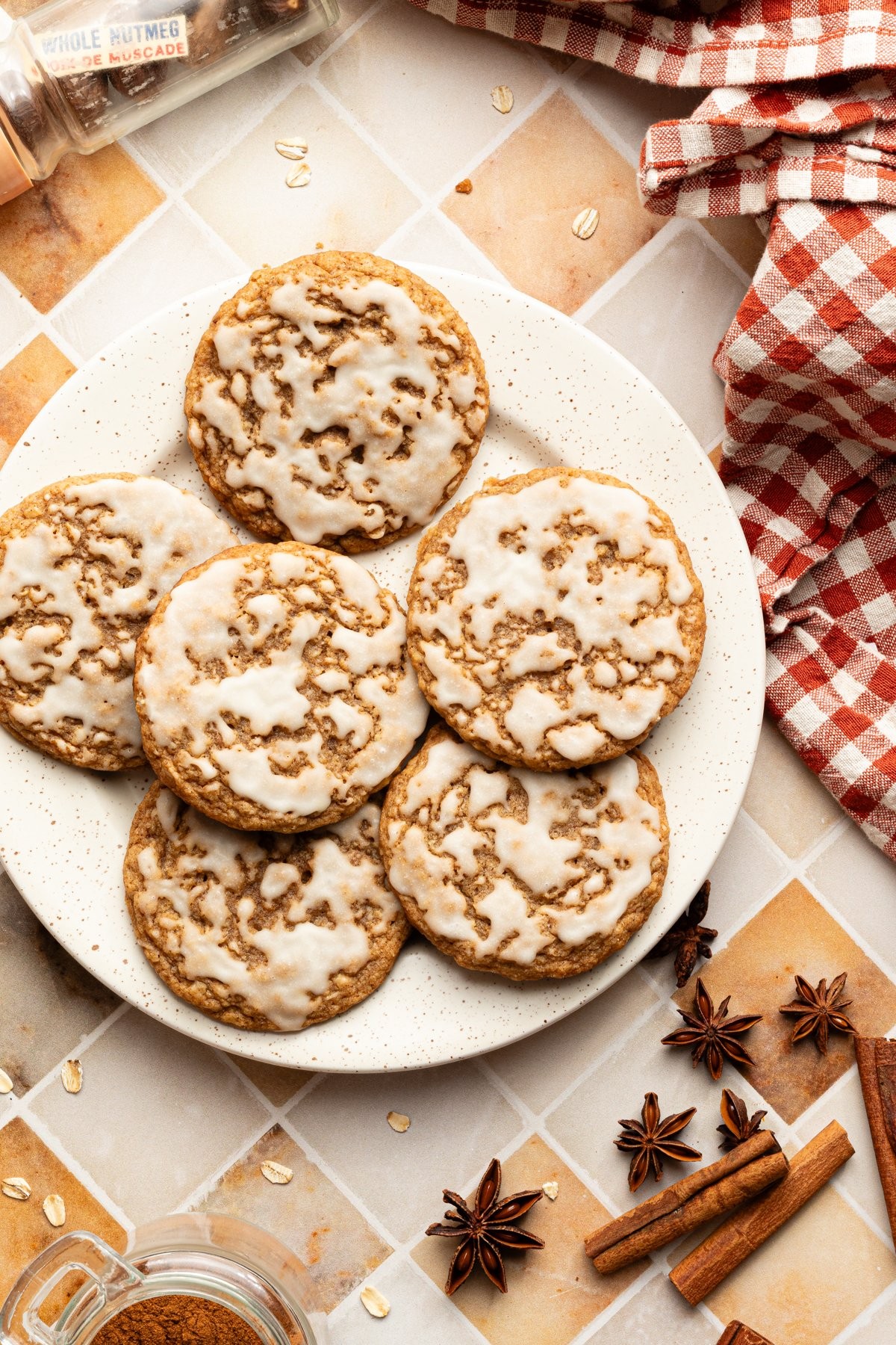 Iced ginger cookies with sweet white glaze, a cozy kitchen setting
