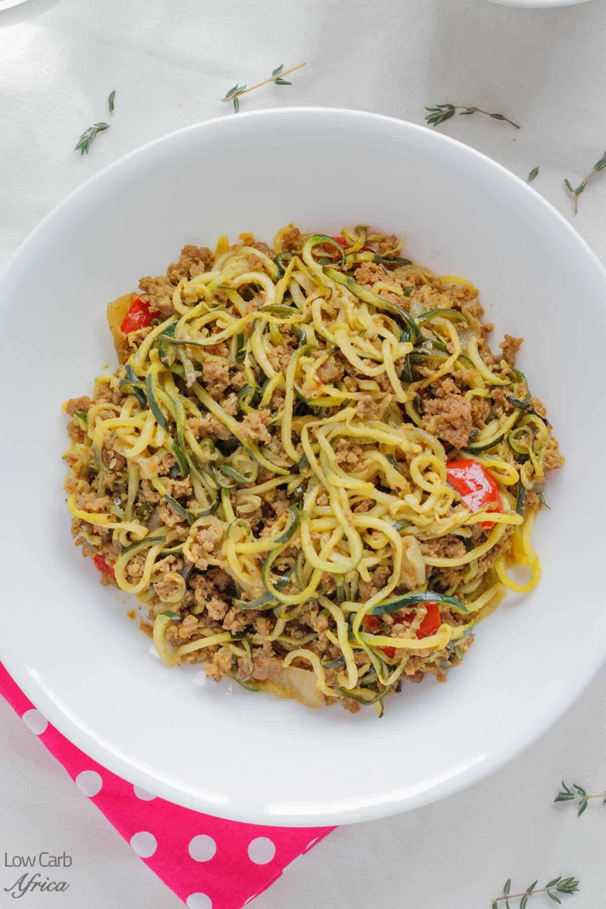 Keto zucchini noodles with ground beef and tomato sauce in a bowl