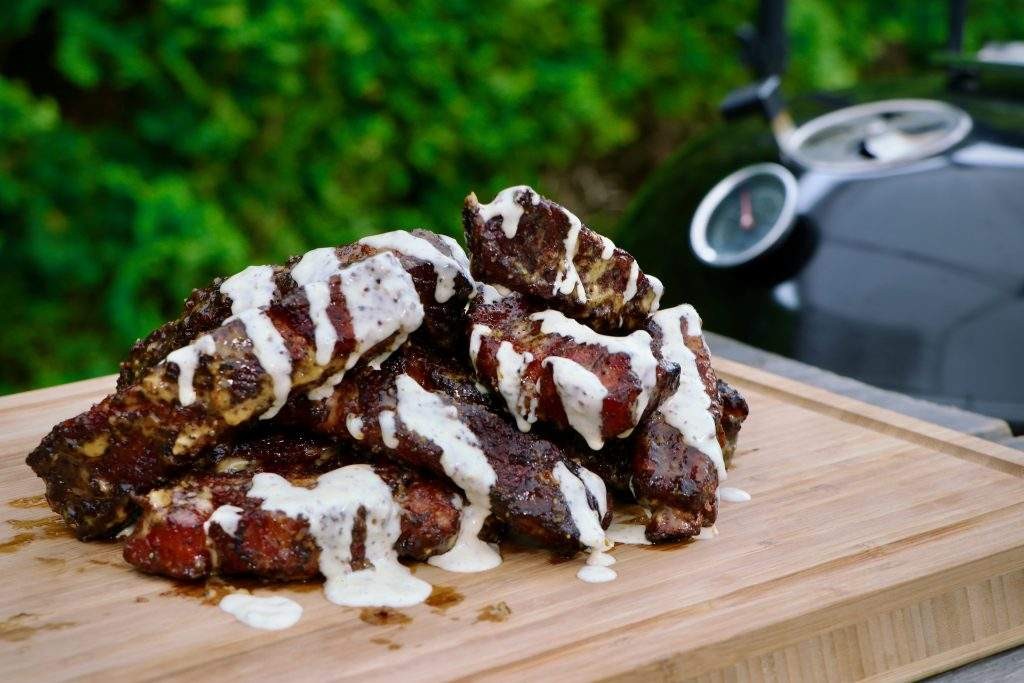 Alabama white BBQ ribs on a smoker