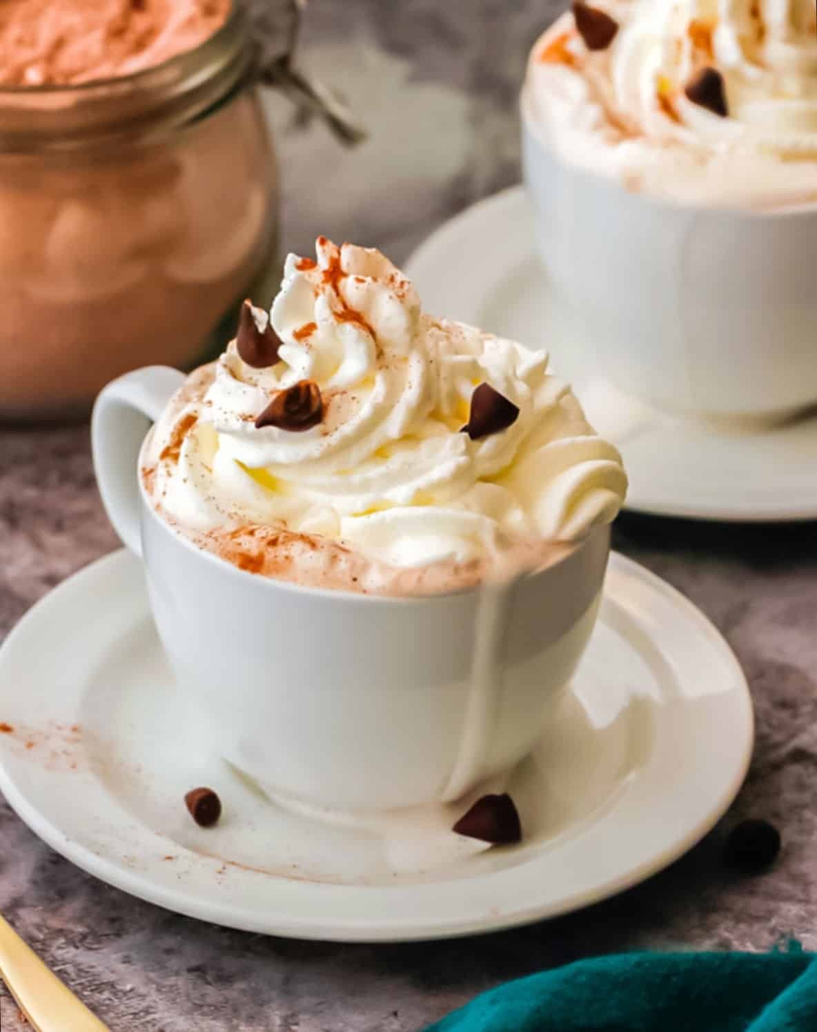 luxurious hot chocolate with a towering whipped cream topping, cozy ambiance