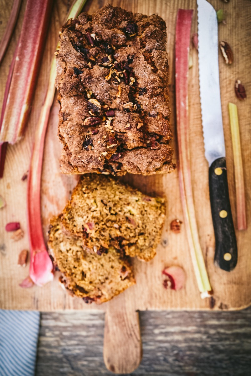 freshly baked rhubarb-date bread on a wooden cutting board