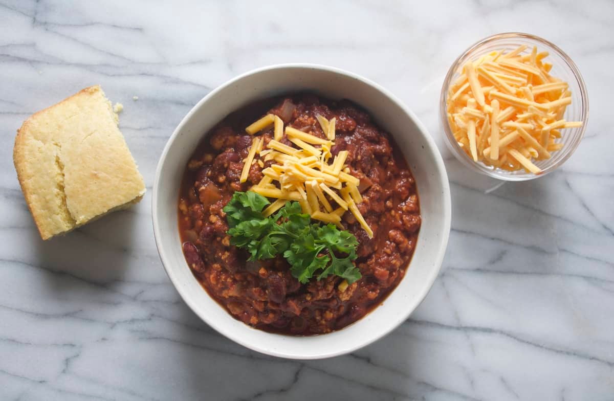 bowl of spicy vegan chili with tofu crumbles