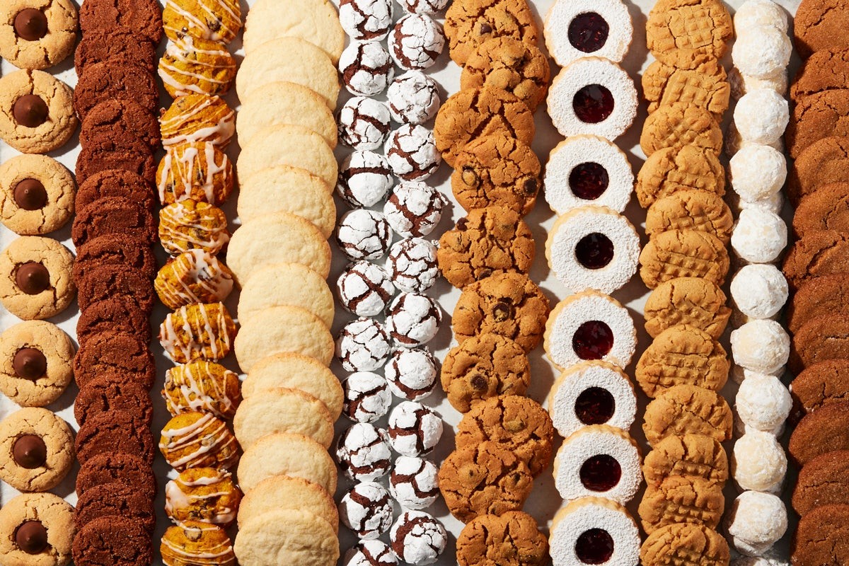 Christmas vanilla cookie bars with snowy white glaze and festive holiday sprinkles, close-up, cozy setting