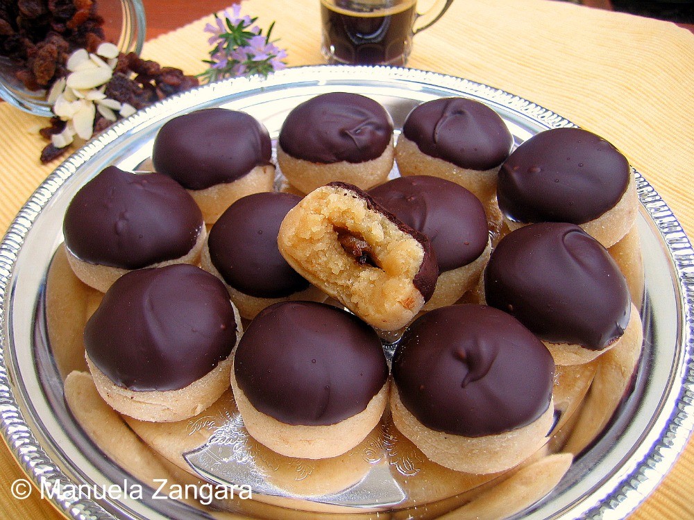 Italian marzipan sweets with Hugo liqueur, close-up