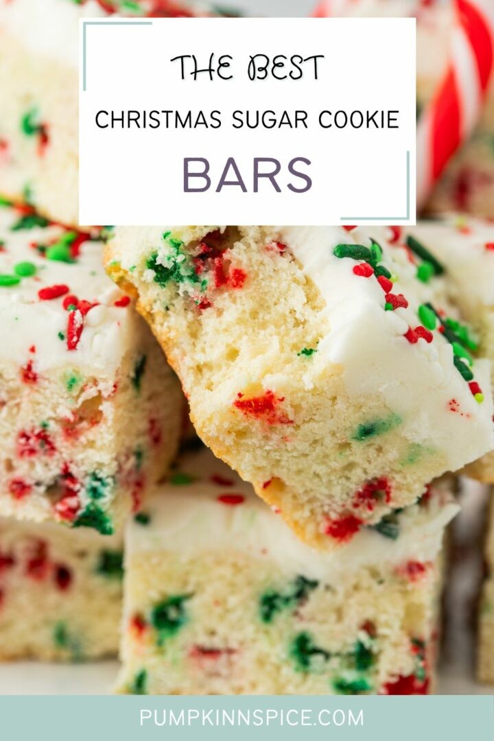 festive christmas french tip vanilla cookie bars with snowy powdered sugar edges on a wire rack with holly