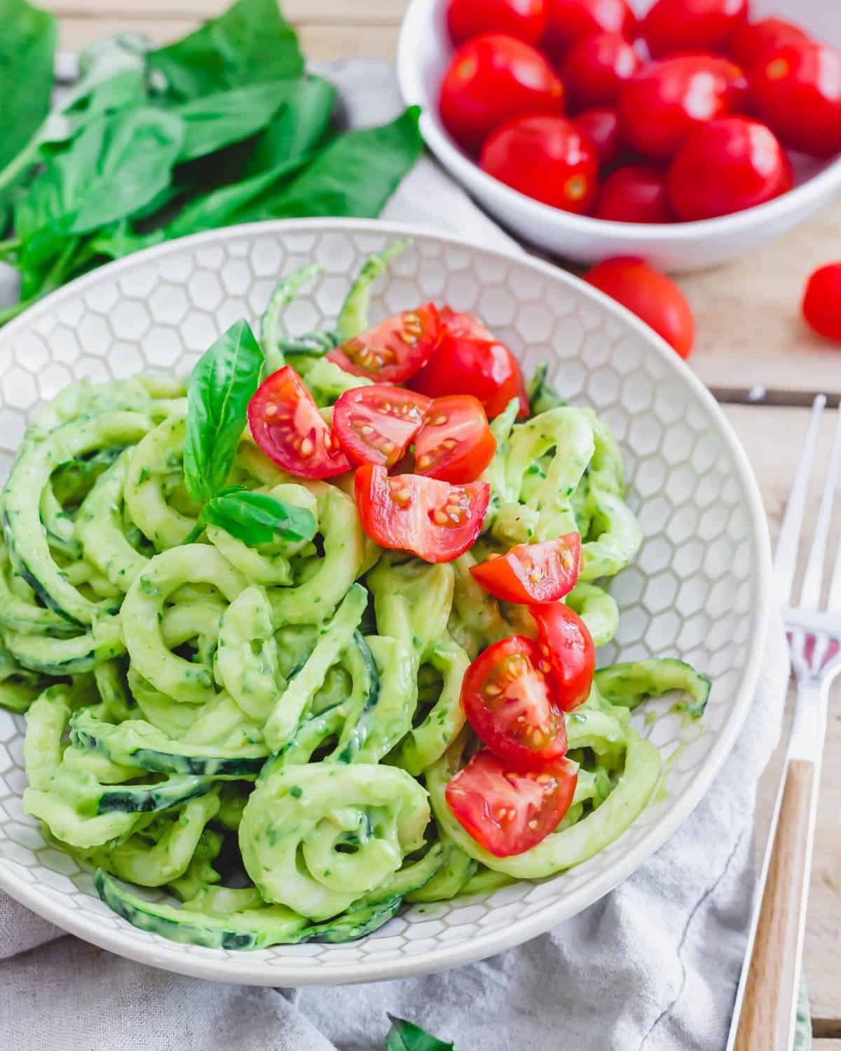 creamy avocado lime zucchini noodles with garnish