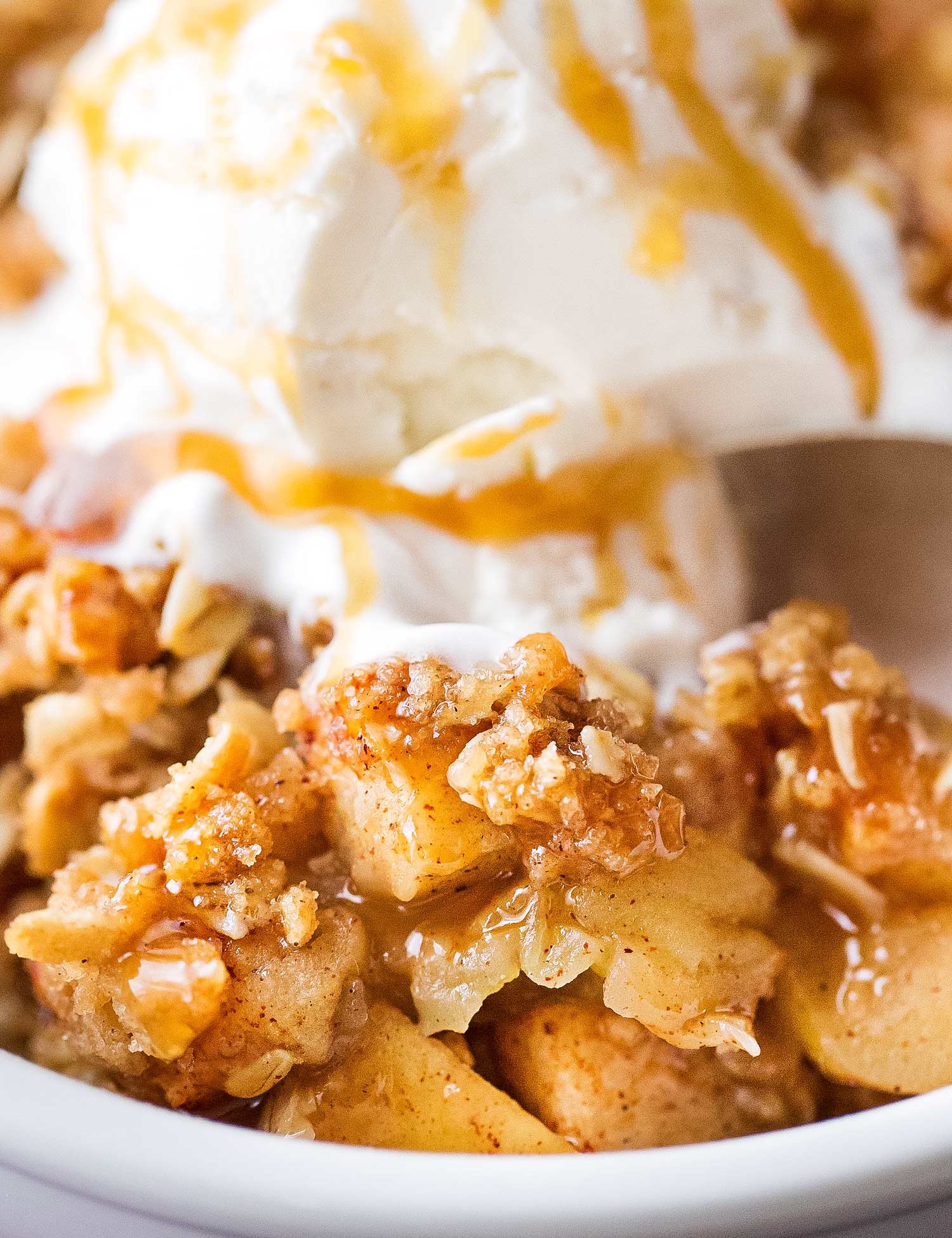 golden brown apple crisp with vanilla ice cream
