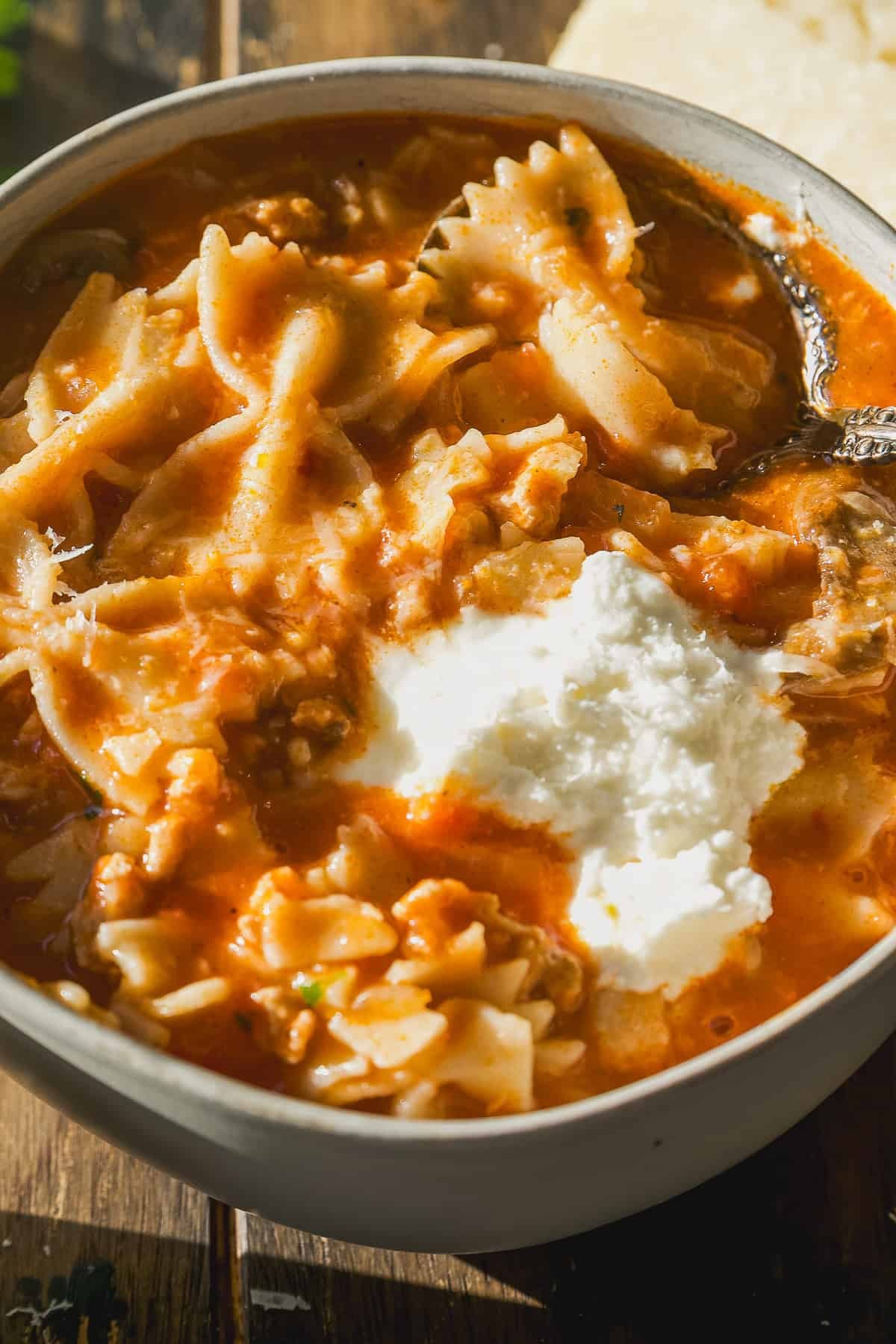 bowl of creamy lasagna soup with ricotta dollops